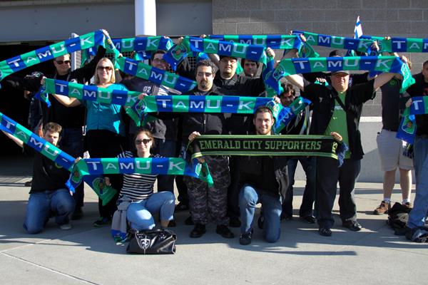A group of Emerald City Supporters with TamU-K scarfs