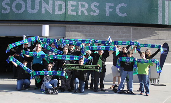 A group of Emerald City Supporters with TamU-K scarfs